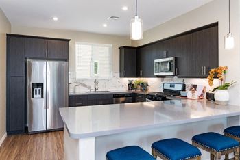 Gourmet kitchens featuring stainless steel appliances and 5 burner gas stoves